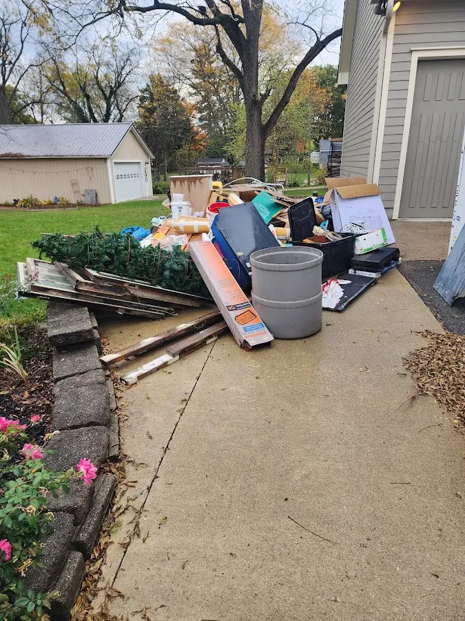 Dumpster being loaded with debris for Residential Dumpster Rental in Winslow